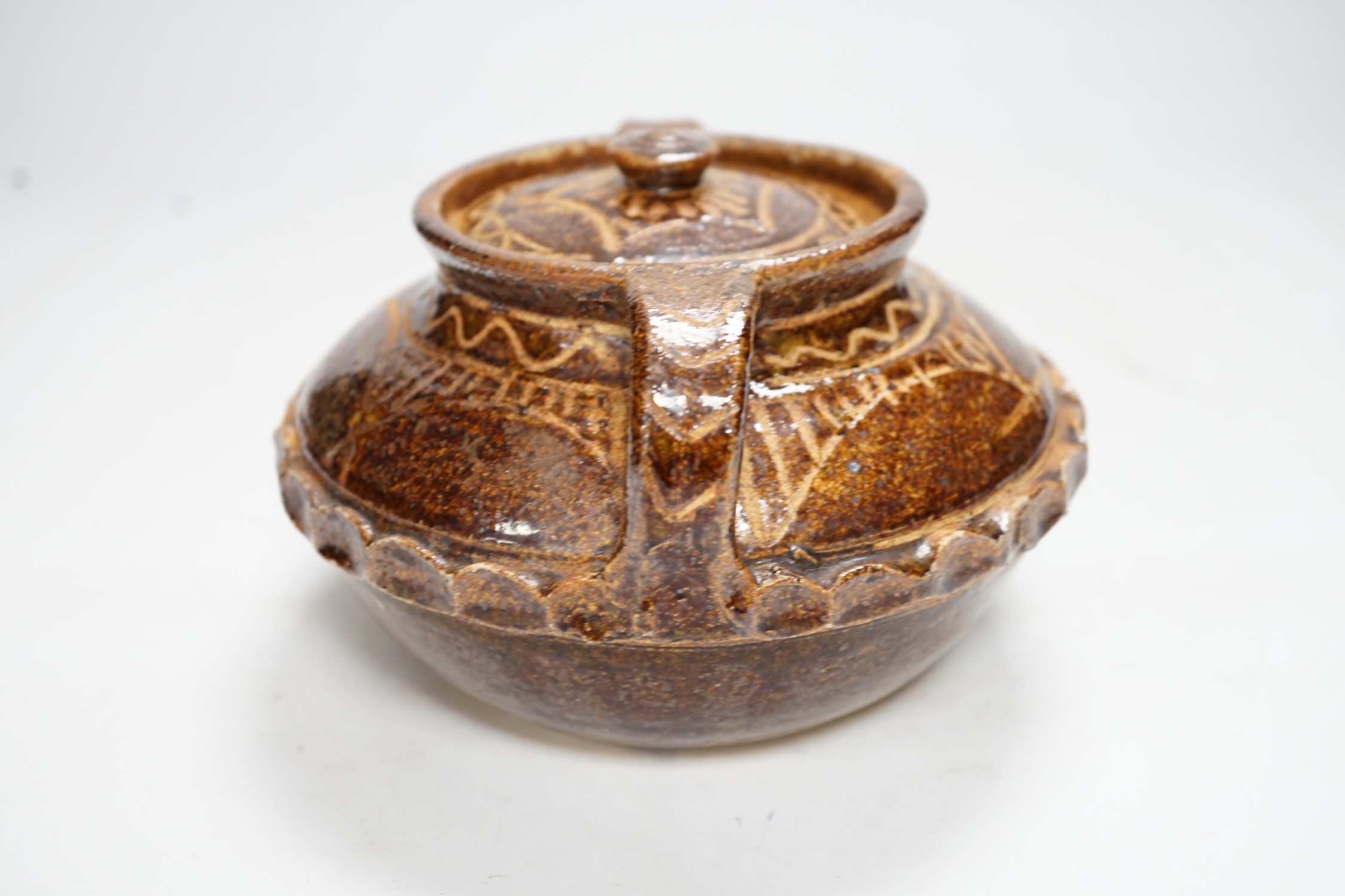 A Wenford Bridge stoneware jar and cover, Gwari, by Michael Cardew, 10cm tall. Condition - fair, cover broken and re-glued